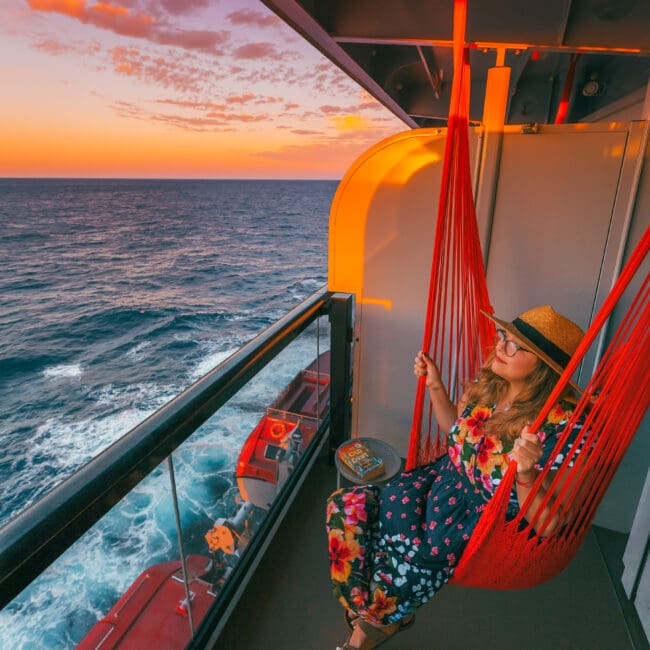 Sitting in a hammock at sunset in our balcony cabin onboard Virgin Voyages