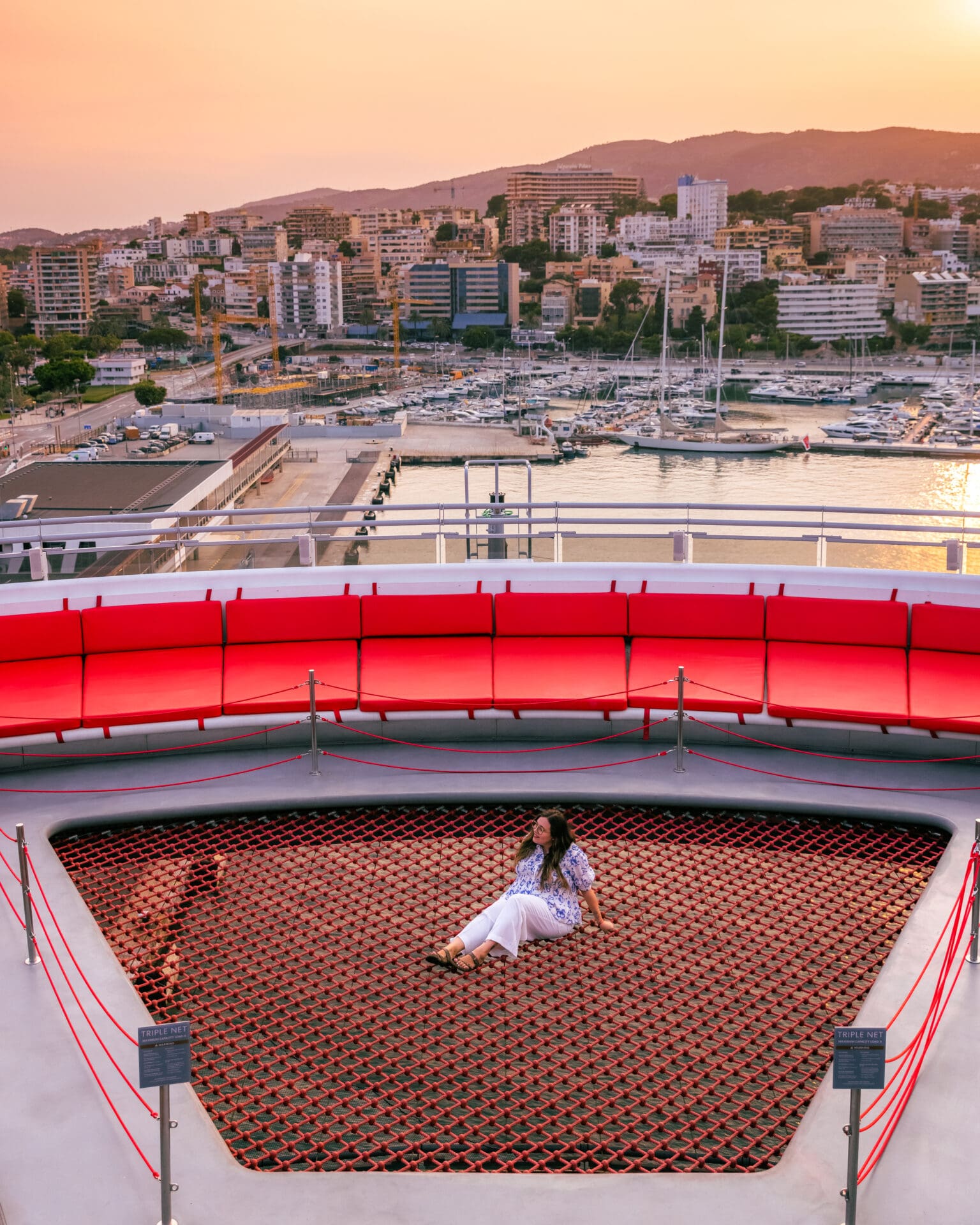 Sitting on The Net on the back of a Virgin Voyages ship at port in Mallorca